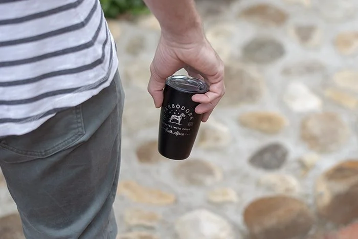 Man holding Terbodore Miir coffee tumblere resuable eco-friendly