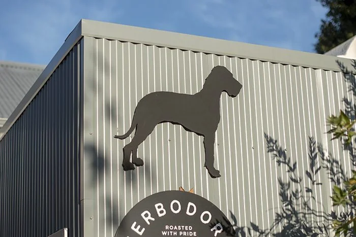 Terbodore Great Dane Dog logo on a building - Terbodore Big Dog Cafe