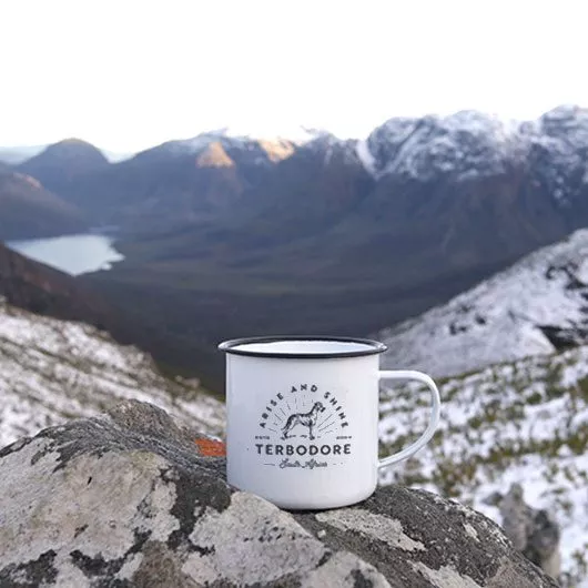 Arise and Shine Terbodore Mug on a Snowy mountain range overlooking the valley