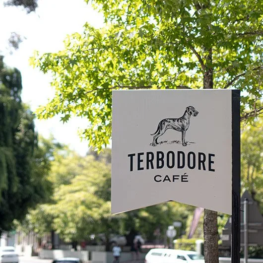 Terbodore Cafe sign with Great Dane Logo - Terbodore Cafe in Franschhoek