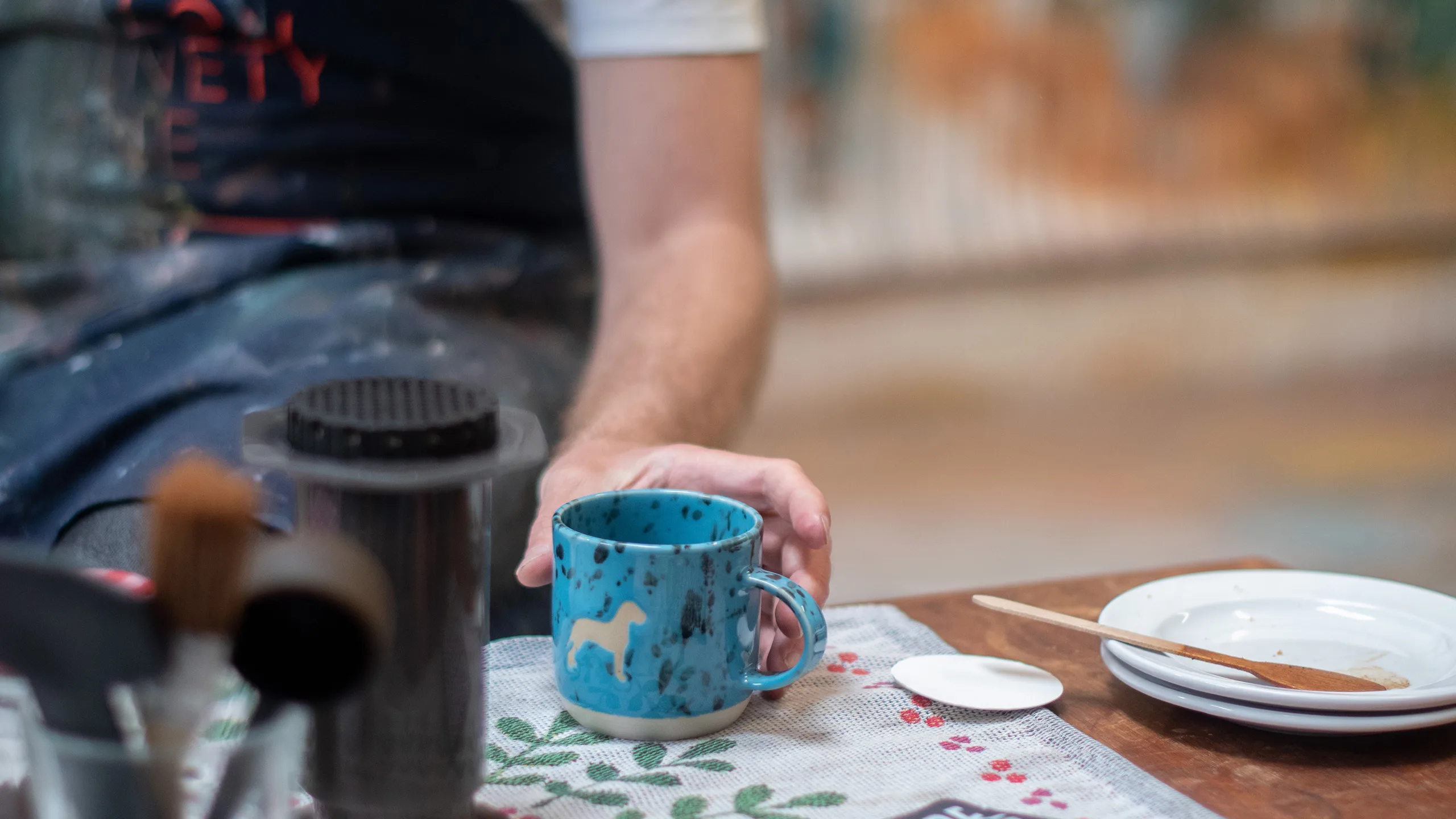 Paul Senyol holding the Harlequin Handmade mug - Terbodore